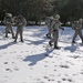 Cold-Weather Operations Course Class 18-05 students practice snowshoeing at Fort McCoy