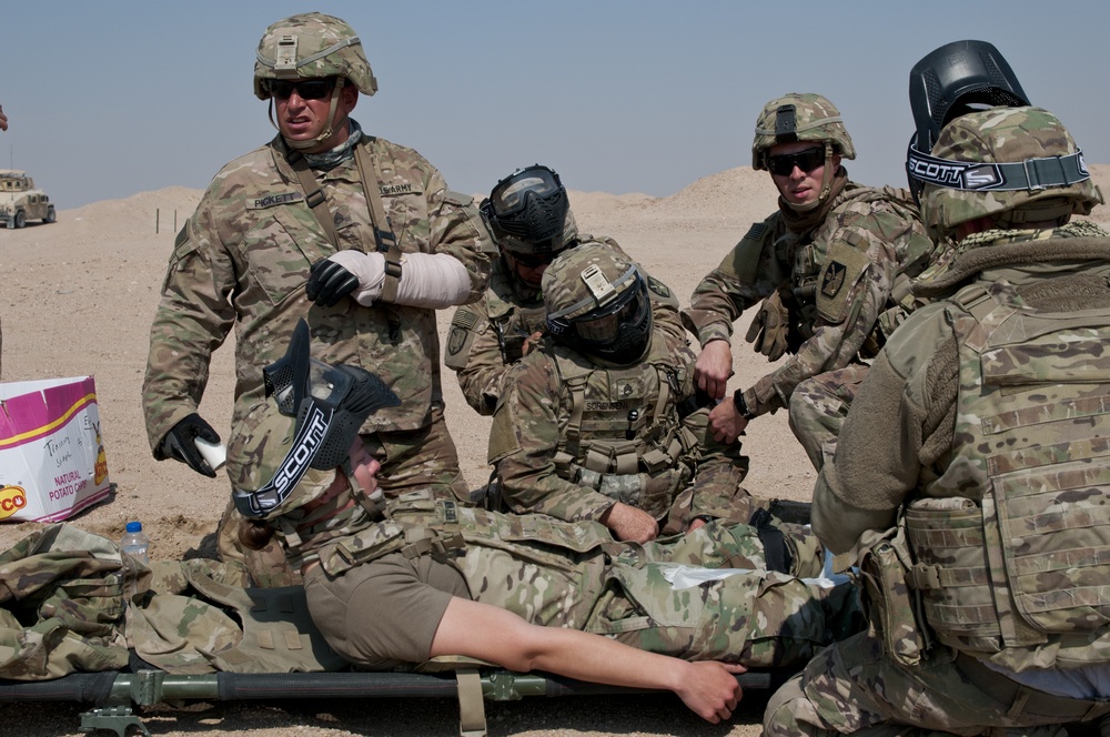 : Medic, other Soldiers treat their buddies in training exercise