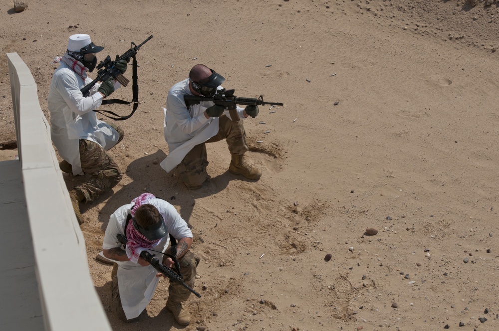 Field artillerymen wage simulated war against unit members