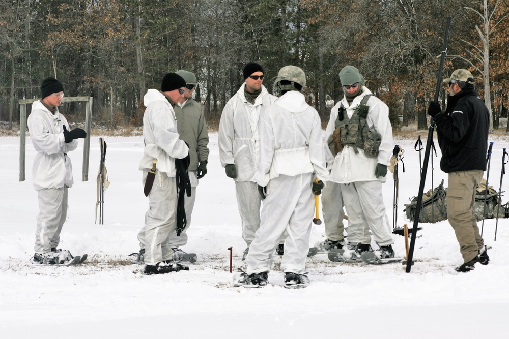 Cold-Weather Operations Course Class 18-06 students build Arctic tents during training at Fort McCoy