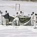Cold-Weather Operations Course Class 18-06 students build Arctic tents during training at Fort McCoy