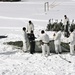 Cold-Weather Operations Course Class 18-06 students build Arctic tents during training at Fort McCoy