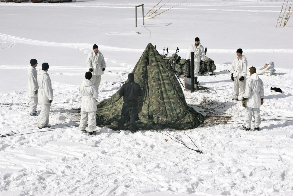 Cold-Weather Operations Course Class 18-06 students build Arctic tents during training at Fort McCoy