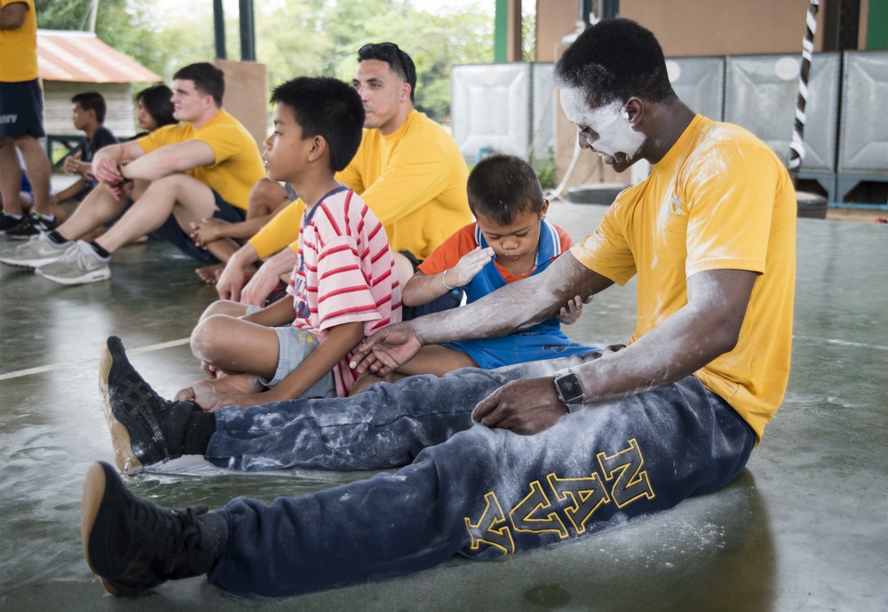 USS Bonhomme Richard (LHD 6) Sailors visit the Child Protection and Development Center as part of COMREL