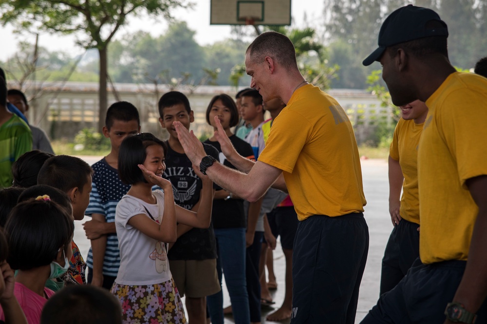 USS Bonhomme Richard (LHD 6) Sailors visit the Child Protection and Development Center as part of COMREL