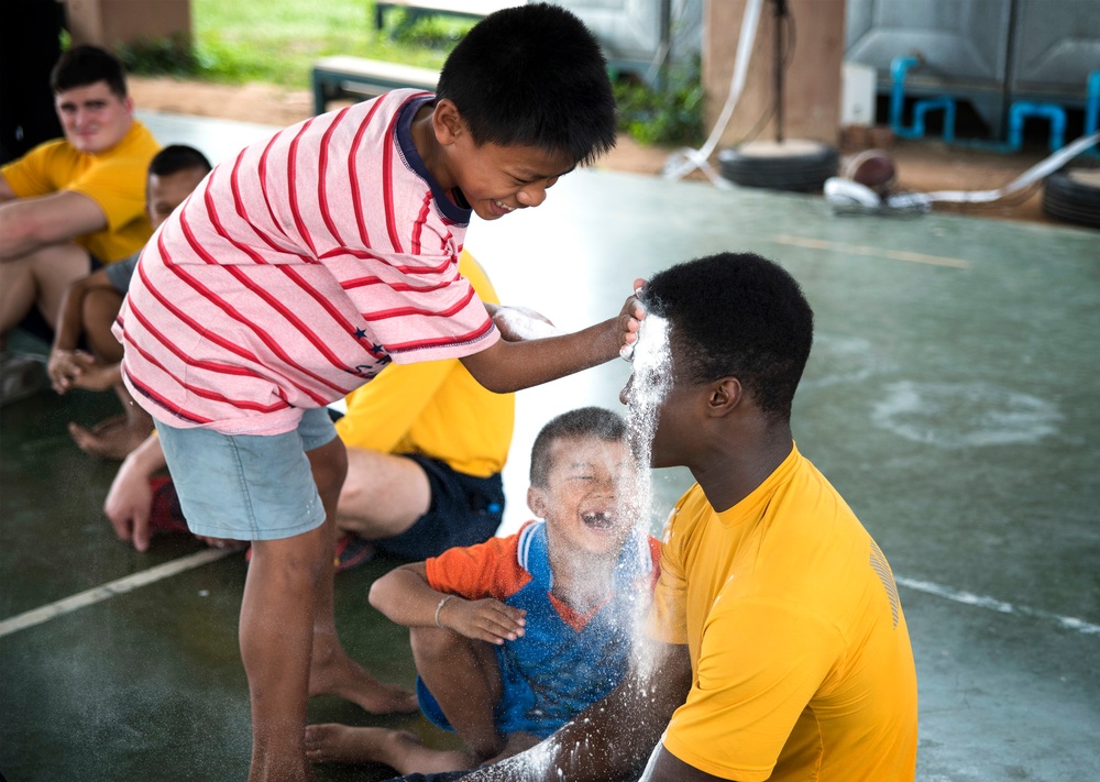 USS Bonhomme Richard (LHD 6) Sailors visit the Child Protection and Development Center as part of COMREL