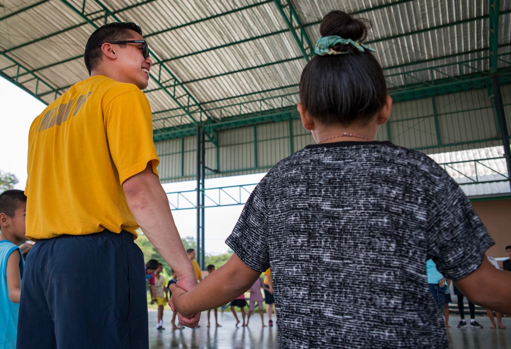 USS Bonhomme Richard (LHD 6) Sailors visit the Child Protection and Development Center as part of COMREL