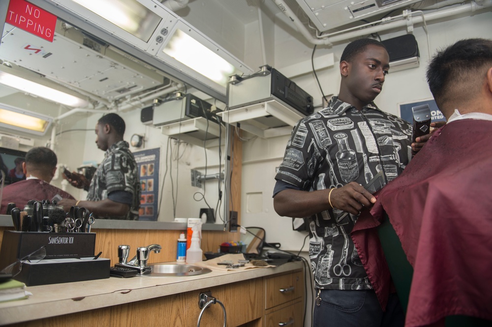 Sailors Get Hair Cuts Aboard USS Sampson