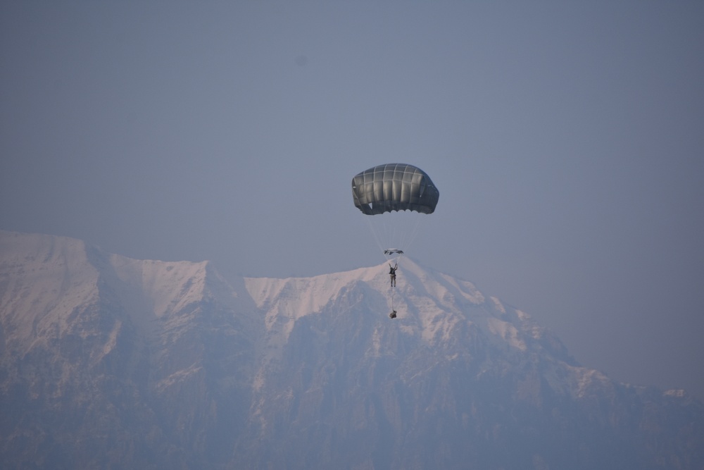 Falling past the snowcapped Dolomites