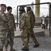 Italian paratroopers exit past USARAF Commander