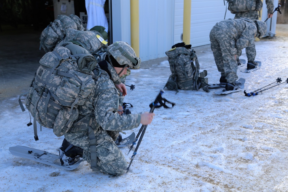 Cold-Weather Operations Course Class 18-05 students practice snowshoeing at Fort McCoy