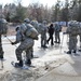 Cold-Weather Operations Course Class 18-05 students practice snowshoeing at Fort McCoy