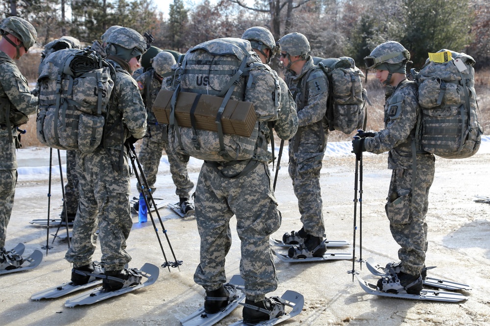 Cold-Weather Operations Course Class 18-05 students practice snowshoeing at Fort McCoy