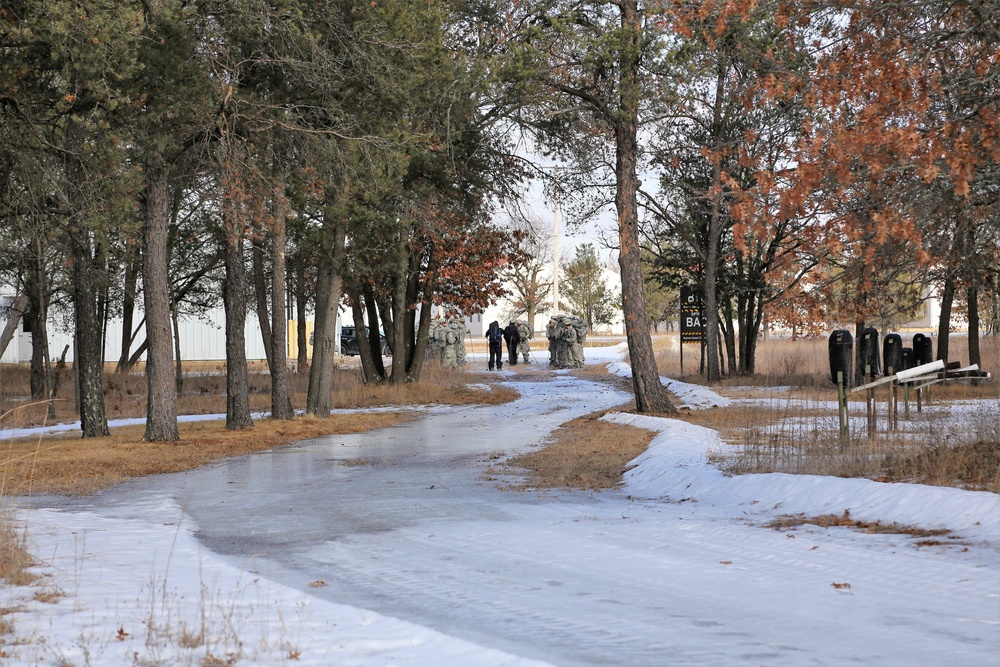 Cold-Weather Operations Course Class 18-05 students practice snowshoeing at Fort McCoy