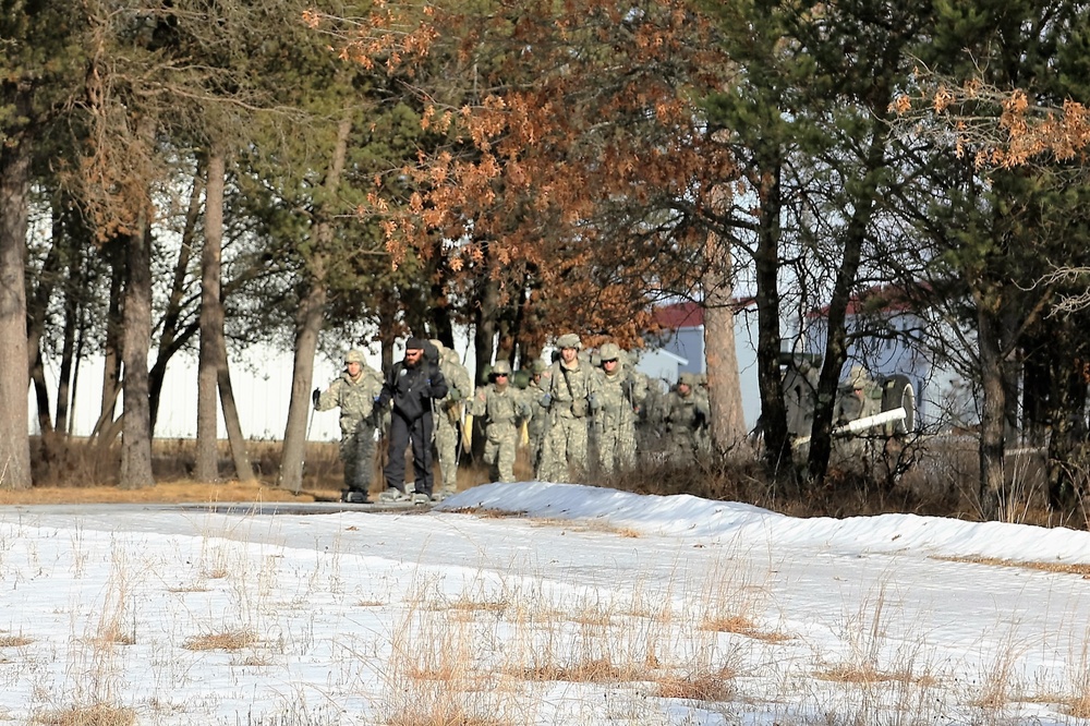 Cold-Weather Operations Course Class 18-05 students practice snowshoeing at Fort McCoy