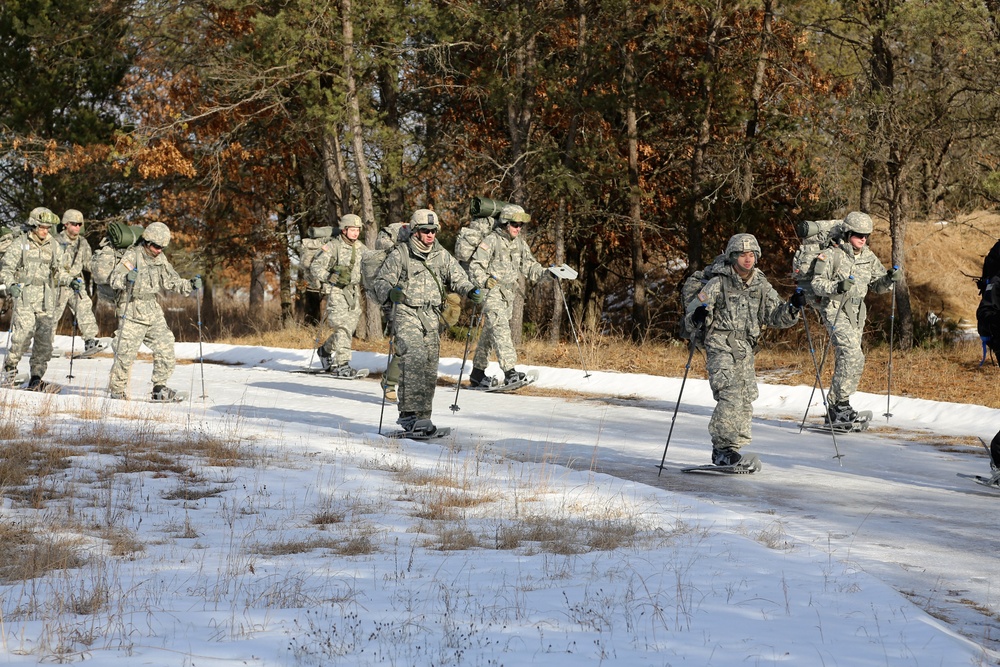 Cold-Weather Operations Course Class 18-05 students practice snowshoeing at Fort McCoy