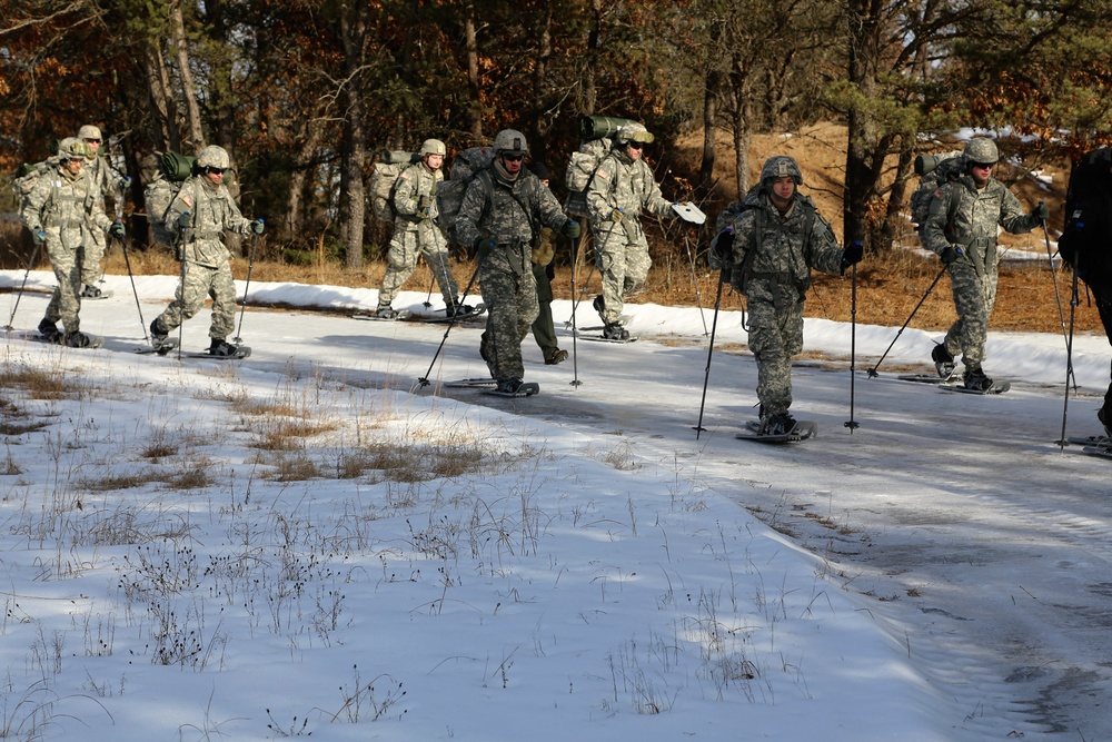 Cold-Weather Operations Course Class 18-05 students practice snowshoeing at Fort McCoy