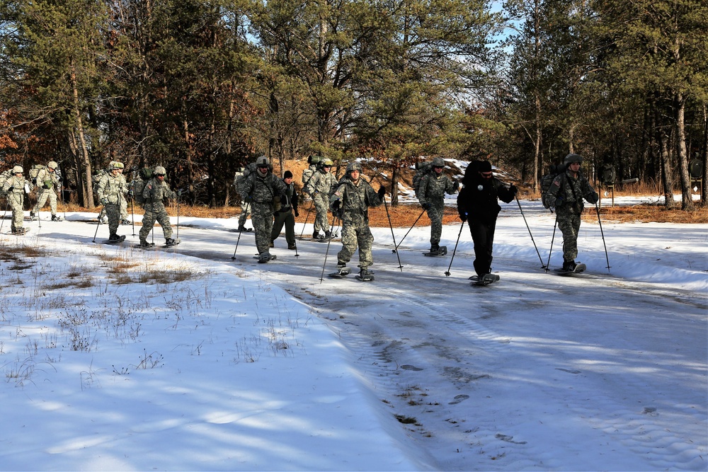 Cold-Weather Operations Course Class 18-05 students practice snowshoeing at Fort McCoy