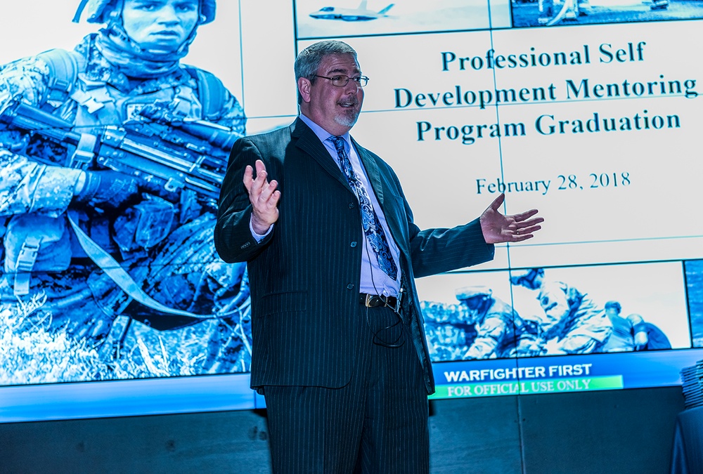 Don Schulze speaks at the graduation ceremony for Land and Maritime’s Professional Self-Development Mentoring Program