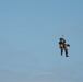 Coast Guard canine and handler deployed from helicopter during training