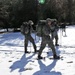 Cold-Weather Operations Course Class 18-05 students practice snowshoeing at Fort McCoy