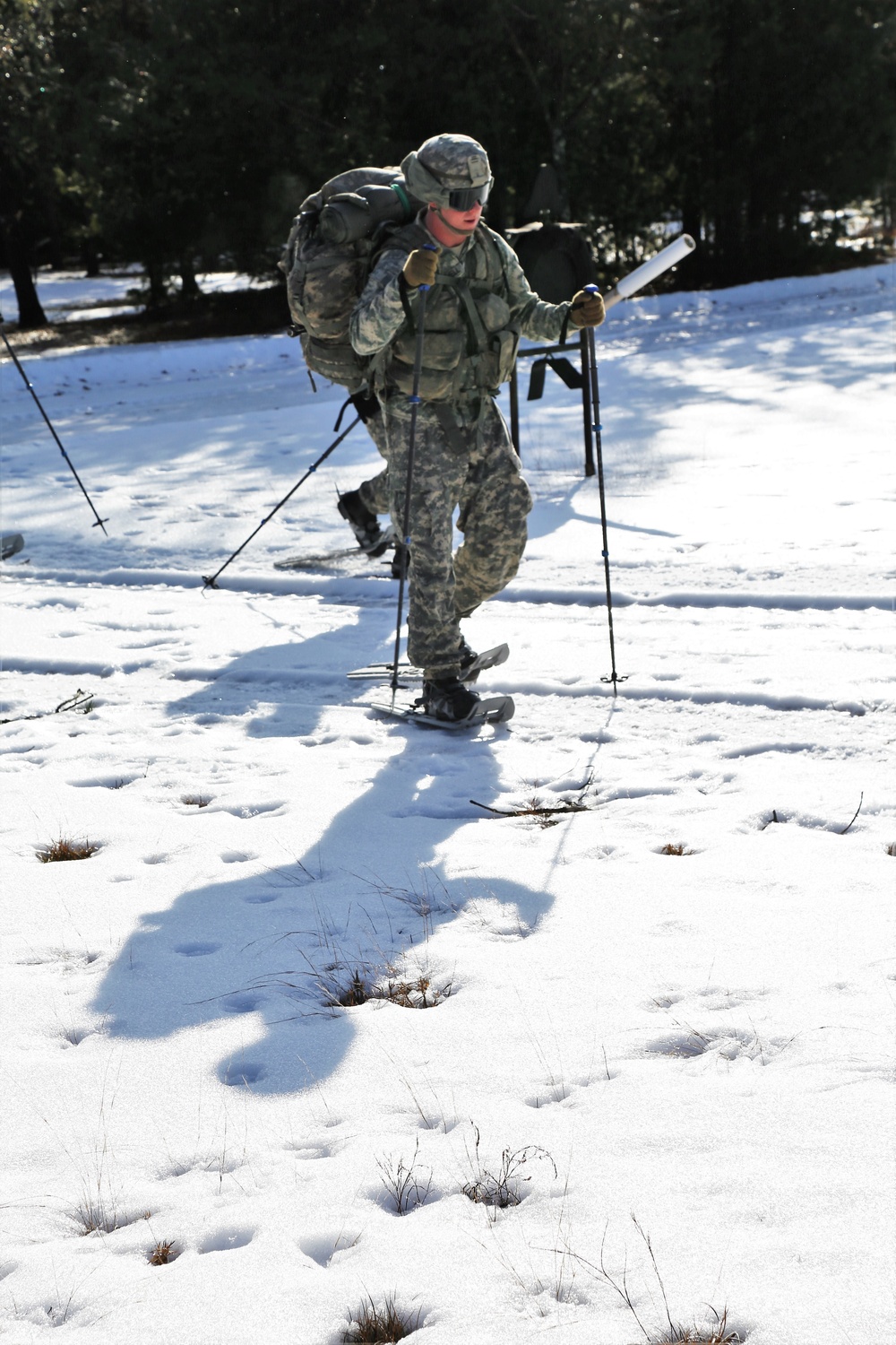 Cold-Weather Operations Course Class 18-05 students practice snowshoeing at Fort McCoy