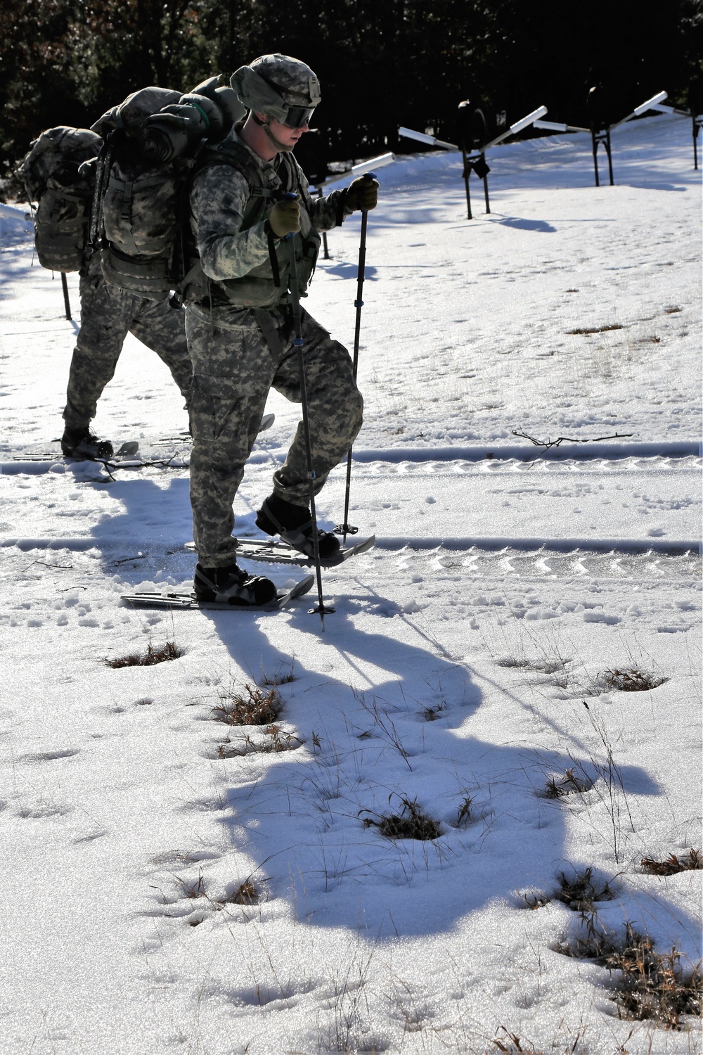 Cold-Weather Operations Course Class 18-05 students practice snowshoeing at Fort McCoy