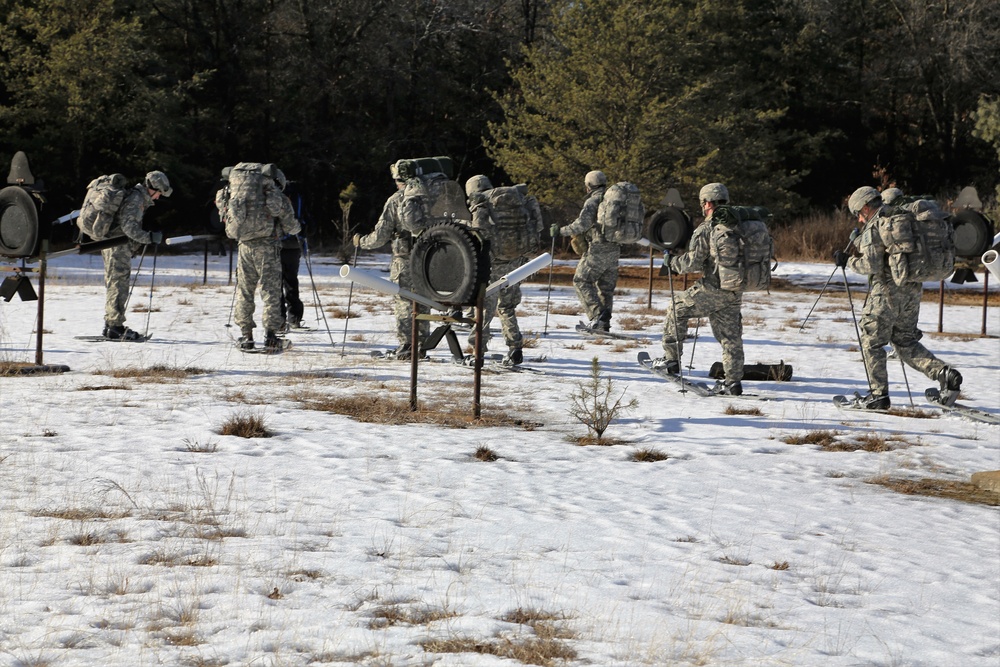 Cold-Weather Operations Course Class 18-05 students practice snowshoeing at Fort McCoy