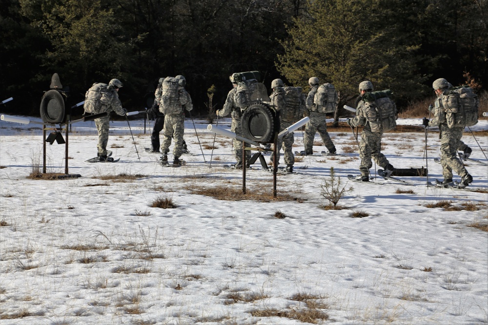 Cold-Weather Operations Course Class 18-05 students practice snowshoeing at Fort McCoy