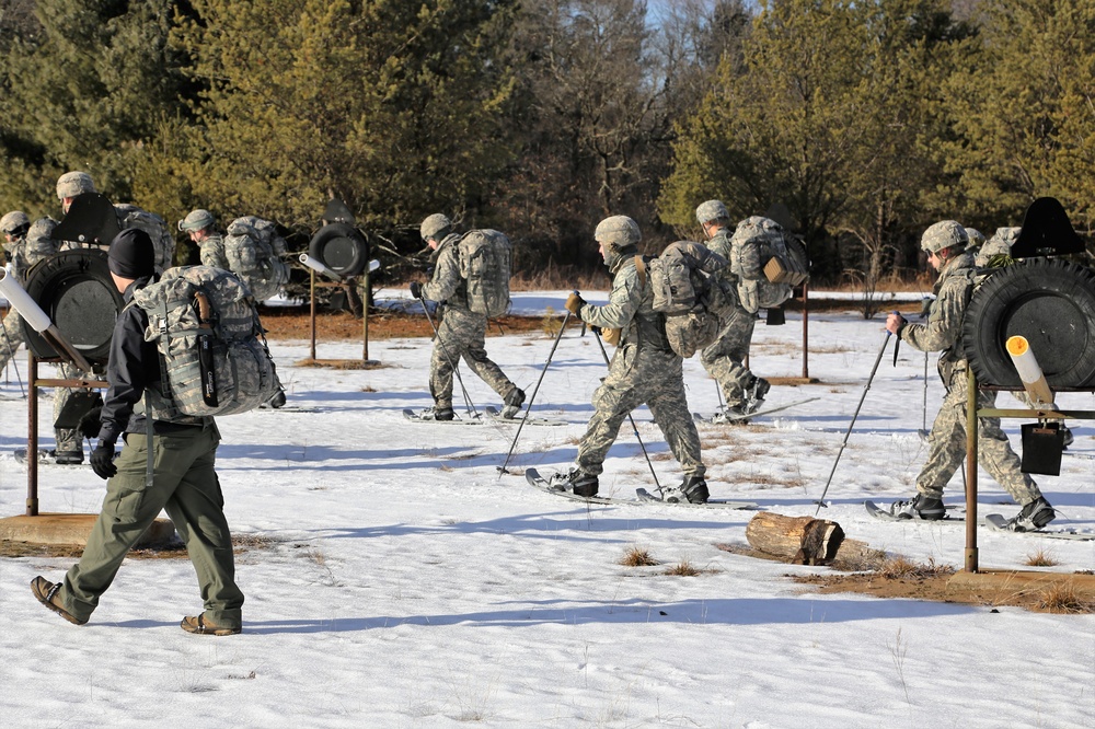 Cold-Weather Operations Course Class 18-05 students practice snowshoeing at Fort McCoy