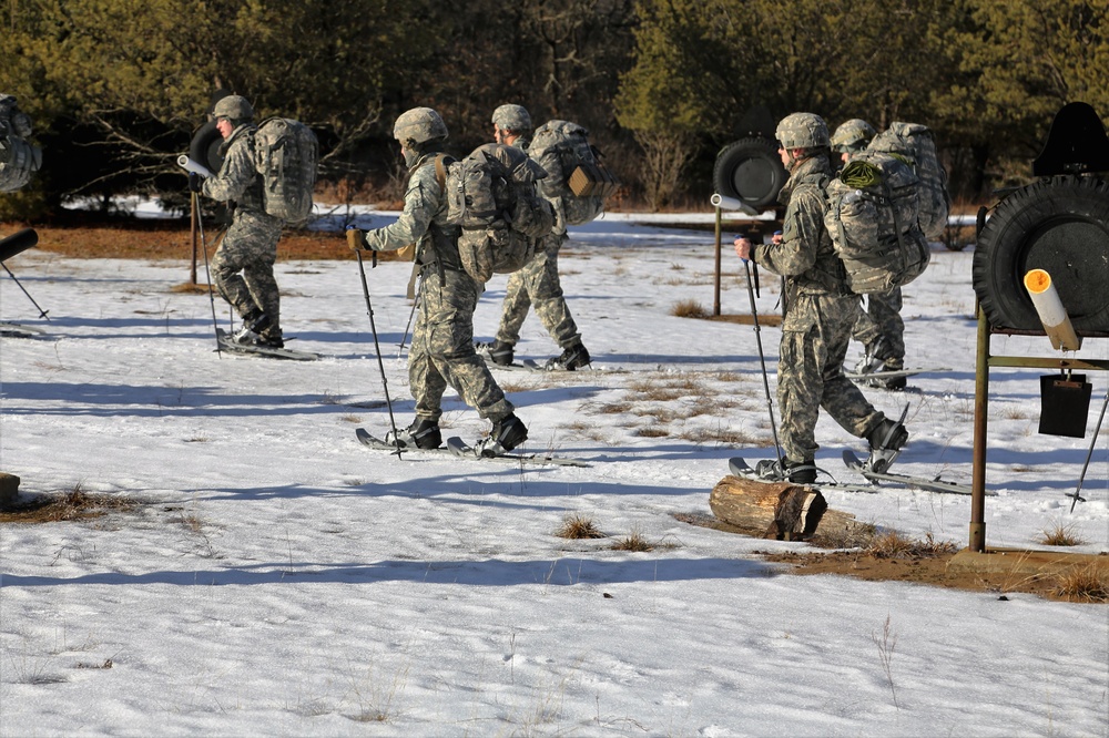 Cold-Weather Operations Course Class 18-05 students practice snowshoeing at Fort McCoy