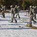 Cold-Weather Operations Course Class 18-05 students practice snowshoeing at Fort McCoy