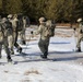 Cold-Weather Operations Course Class 18-05 students practice snowshoeing at Fort McCoy