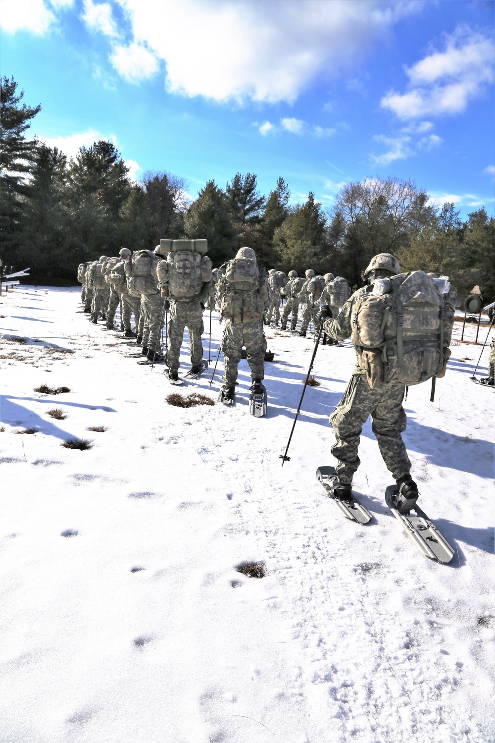 Cold-Weather Operations Course Class 18-05 students practice snowshoeing at Fort McCoy