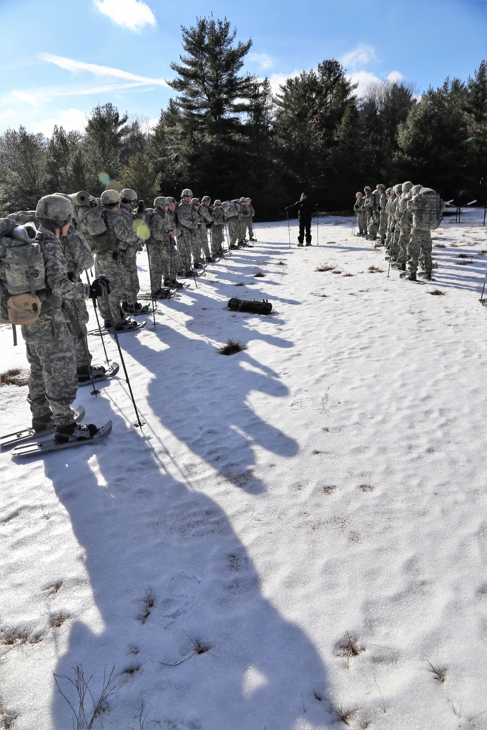 Cold-Weather Operations Course Class 18-05 students practice snowshoeing at Fort McCoy