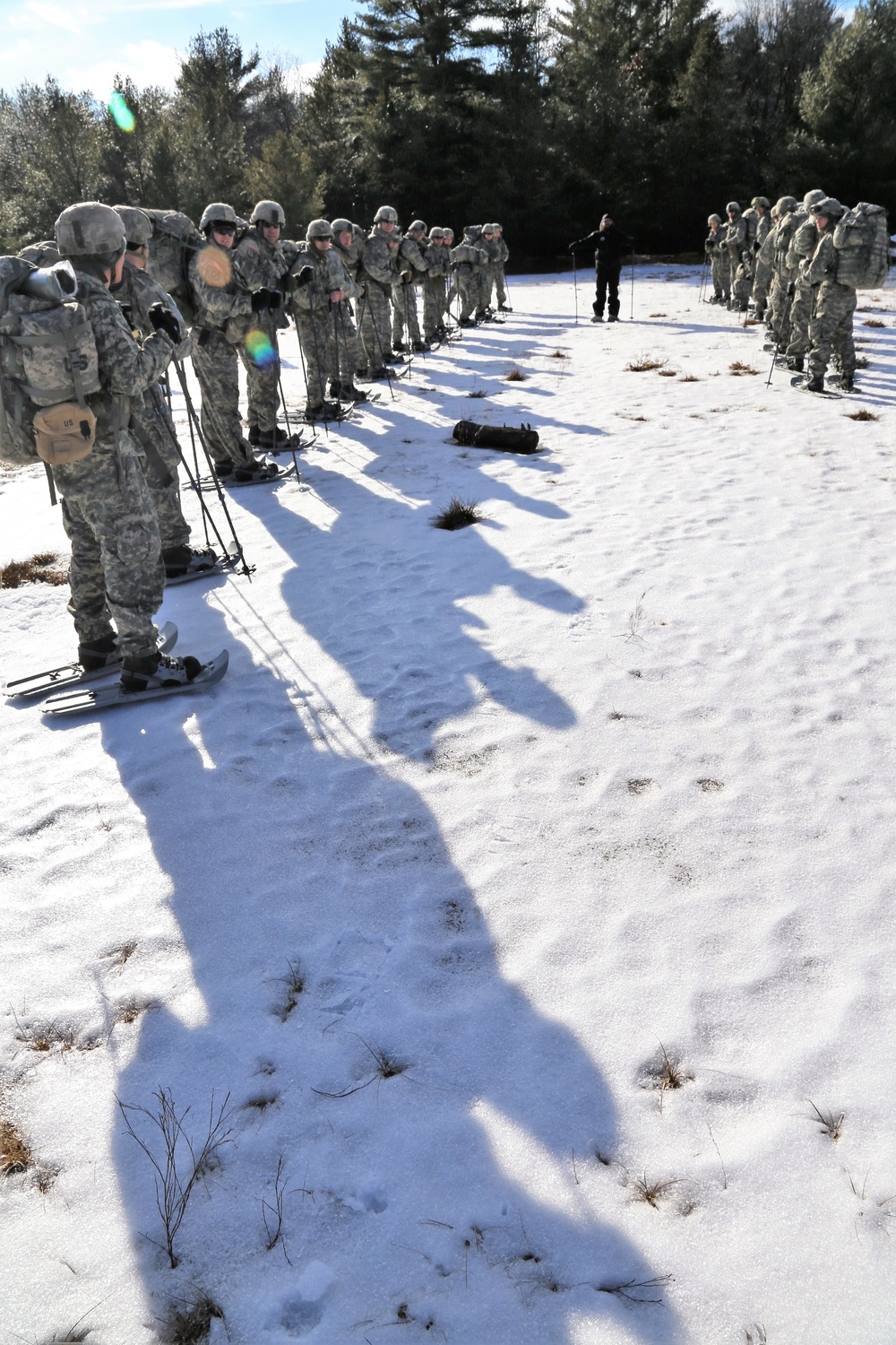 Cold-Weather Operations Course Class 18-05 students practice snowshoeing at Fort McCoy