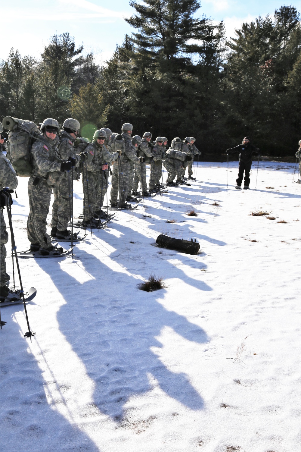 Cold-Weather Operations Course Class 18-05 students practice snowshoeing at Fort McCoy