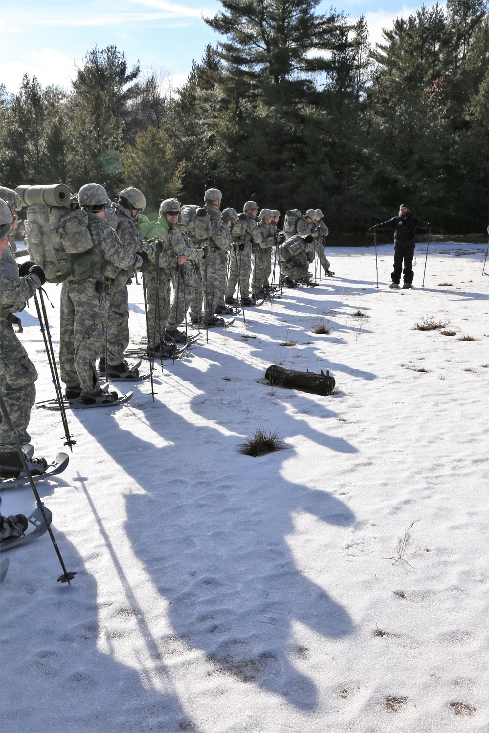 Cold-Weather Operations Course Class 18-05 students practice snowshoeing at Fort McCoy