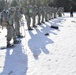 Cold-Weather Operations Course Class 18-05 students practice snowshoeing at Fort McCoy