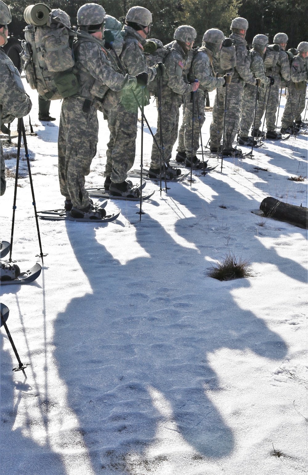 Cold-Weather Operations Course Class 18-05 students practice snowshoeing at Fort McCoy