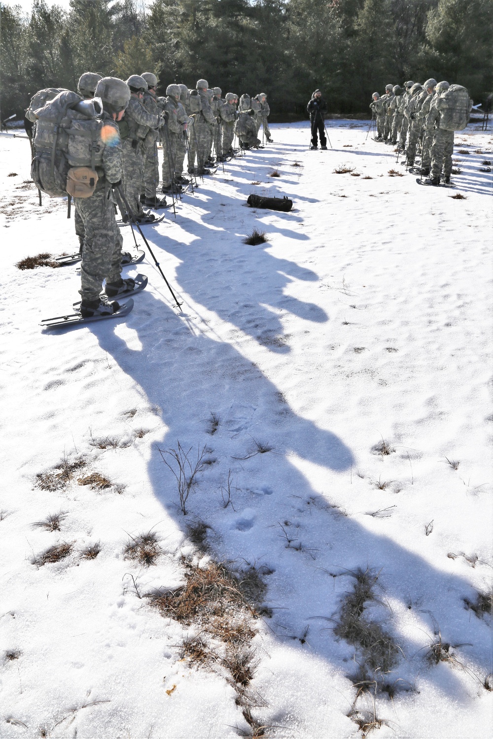 Cold-Weather Operations Course Class 18-05 students practice snowshoeing at Fort McCoy