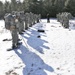 Cold-Weather Operations Course Class 18-05 students practice snowshoeing at Fort McCoy