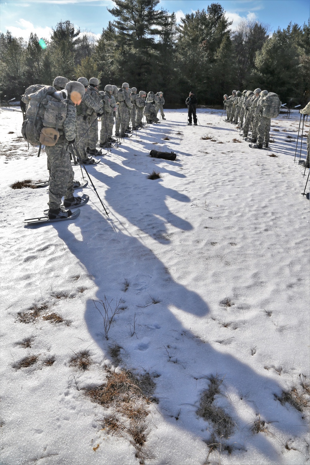 Cold-Weather Operations Course Class 18-05 students practice snowshoeing at Fort McCoy