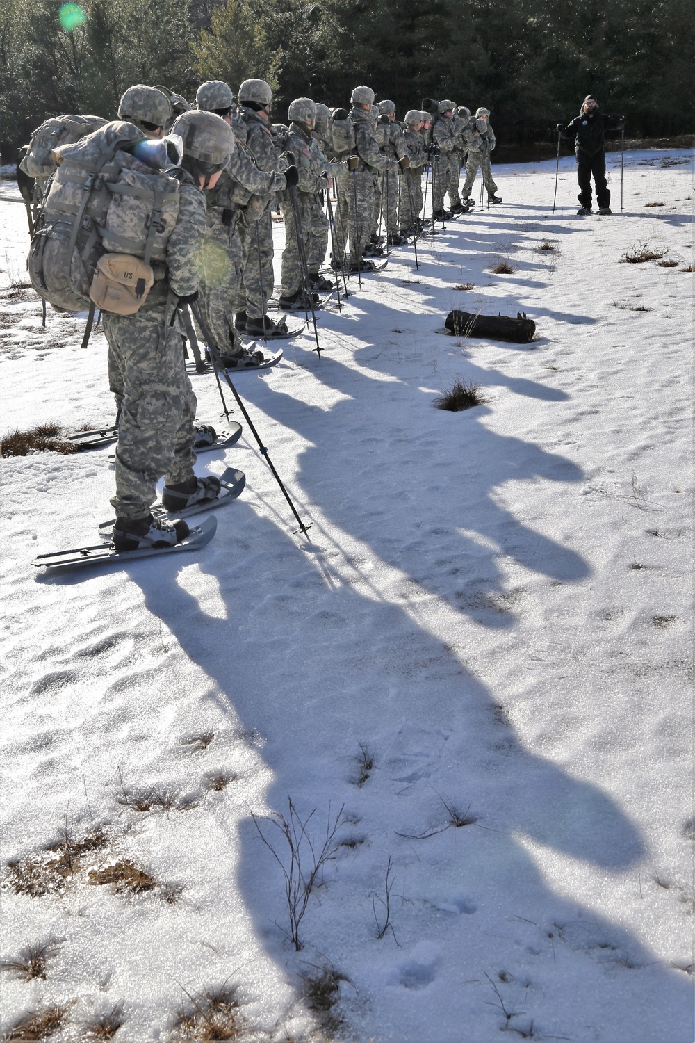 Cold-Weather Operations Course Class 18-05 students practice snowshoeing at Fort McCoy