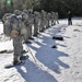 Cold-Weather Operations Course Class 18-05 students practice snowshoeing at Fort McCoy