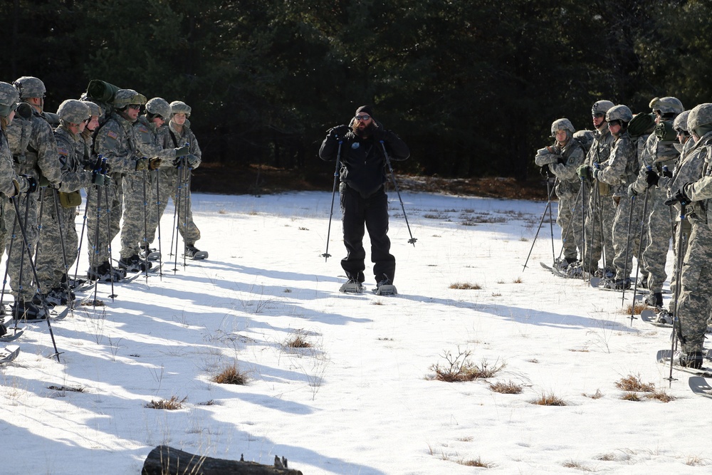 Cold-Weather Operations Course Class 18-05 students practice snowshoeing at Fort McCoy