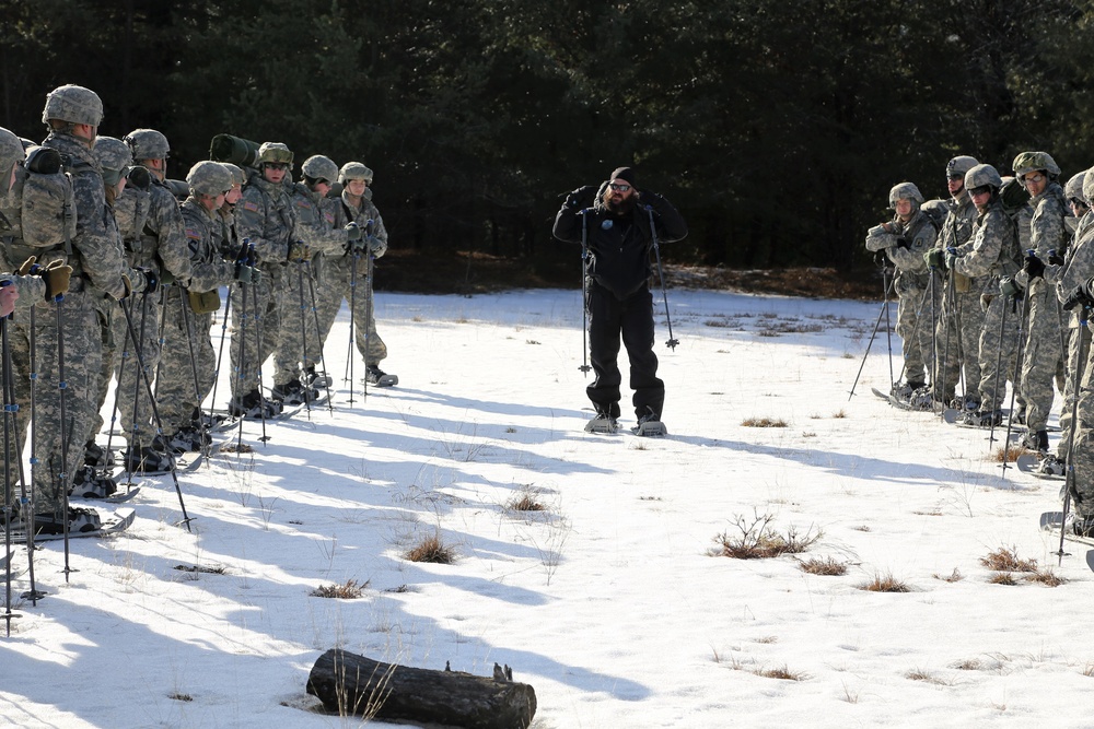 Cold-Weather Operations Course Class 18-05 students practice snowshoeing at Fort McCoy