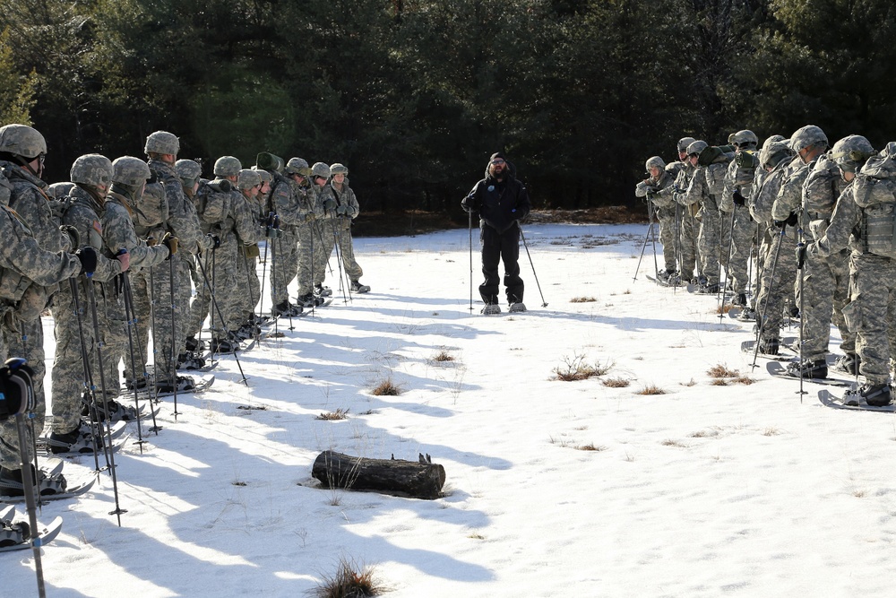 Cold-Weather Operations Course Class 18-05 students practice snowshoeing at Fort McCoy