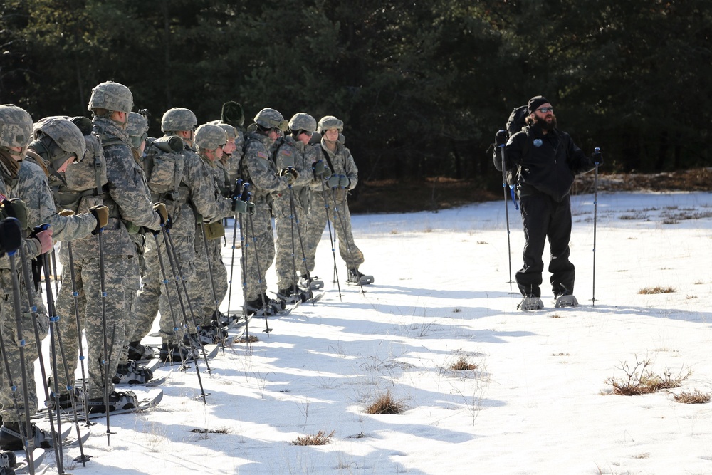 Cold-Weather Operations Course Class 18-05 students practice snowshoeing at Fort McCoy