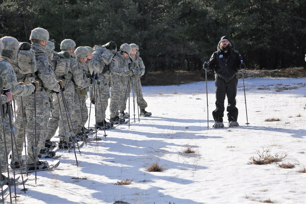 Cold-Weather Operations Course Class 18-05 students practice snowshoeing at Fort McCoy